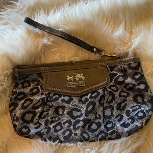 Medium Coach wristlet , black and silver leopard print with purple interior